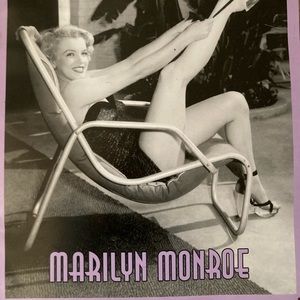 Black and white print of Marilyn Monroe on tin with purple border.